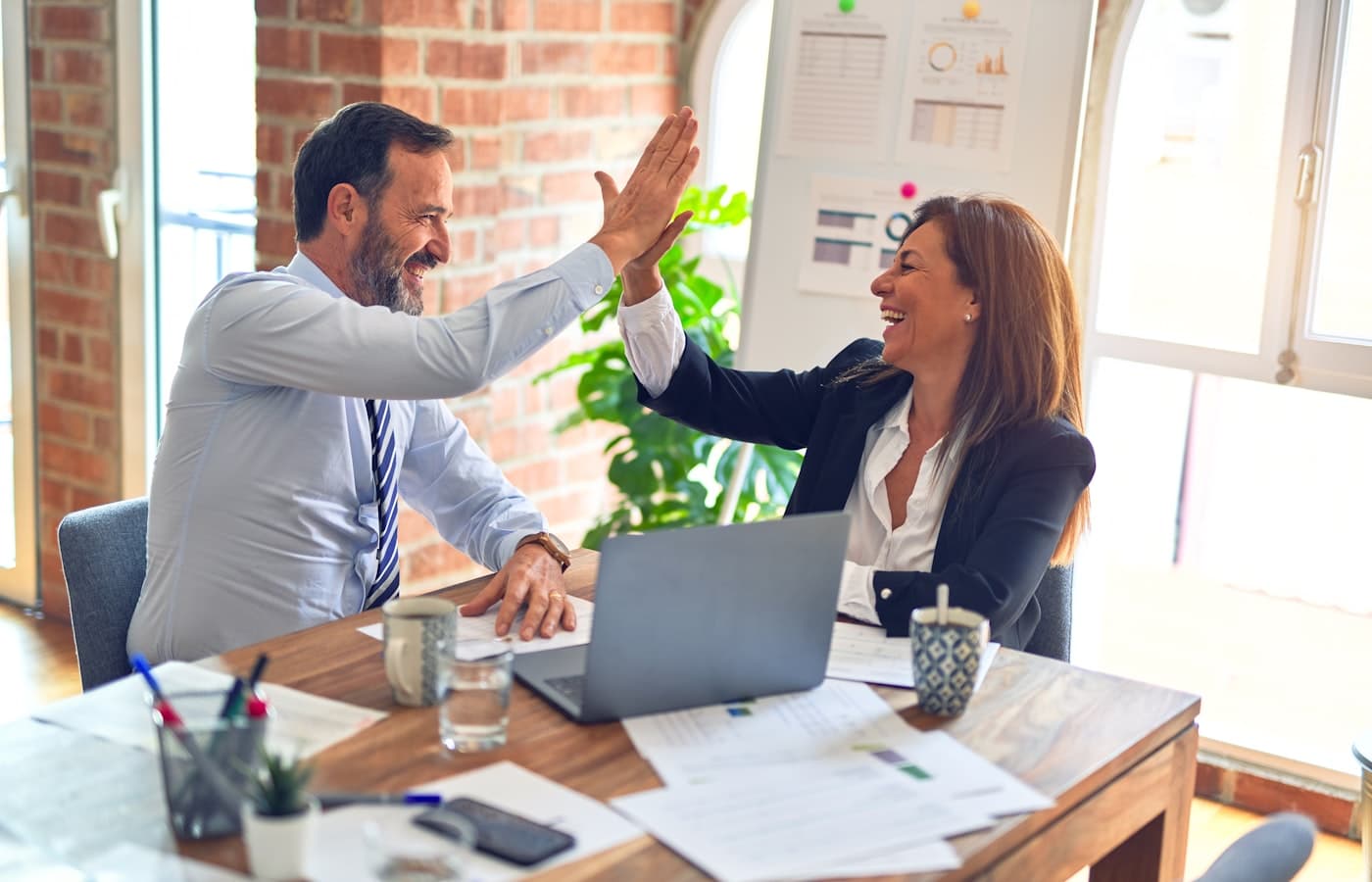 Event managers collaborating in a bright office